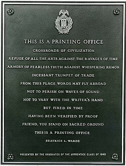 The bronze plaque in the lobby of the US Government Printing Office, the text cast in capitals and signed Beatrice L. Warde, presented by the graduates of the apprentice class of 1940